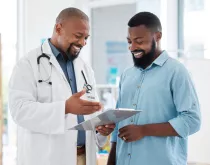 physician with a patient both satisfied with the interaction